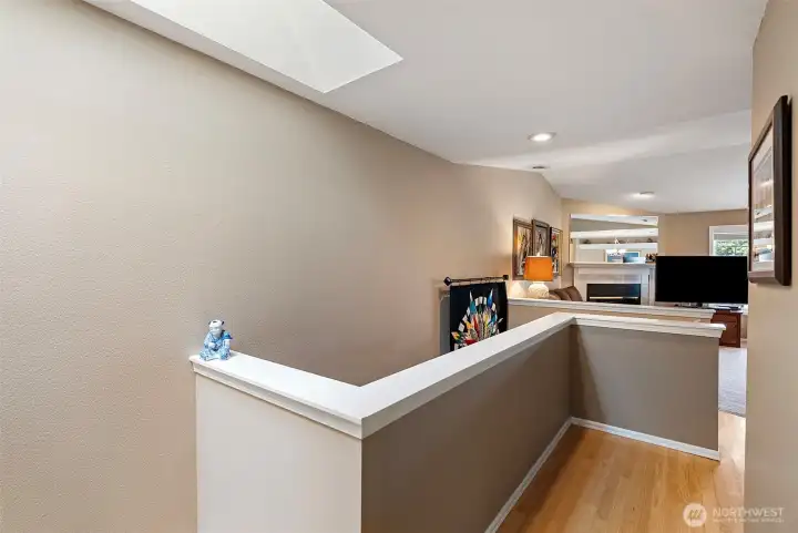 Spacious 2-level condo featuring a versatile main living floor. This level includes a bright living room, dining area, and a beautiful and functional kitchen. It also hosts the primary bedroom, a second bedroom perfect for guests or a home office, and a convenient utility room located within one of the two bathrooms. The space is beautifully accented by a skylight that fills the area with natural light.