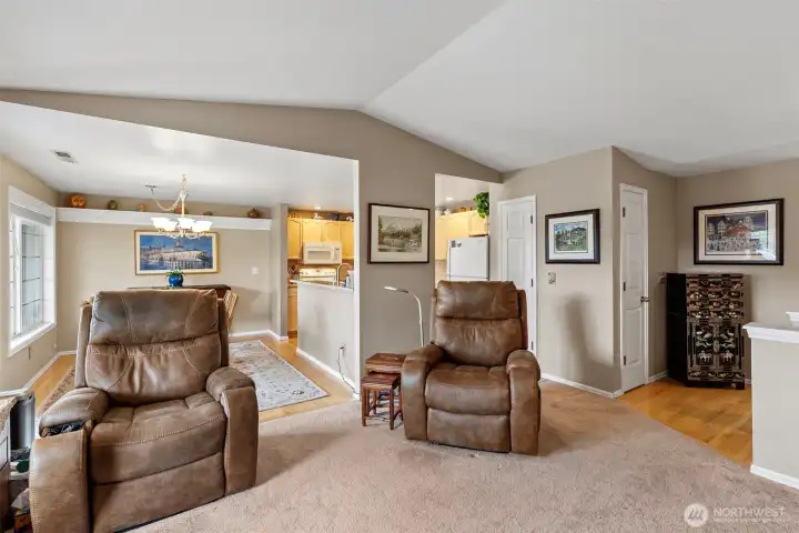 The vaulted ceilings and skylights keep the ambiance light and bright, creating an airy and welcoming atmosphere throughout the home. This feature adds a sense of spaciousness and architectural character, ensuring the interior remains naturally illuminated throughout the day.