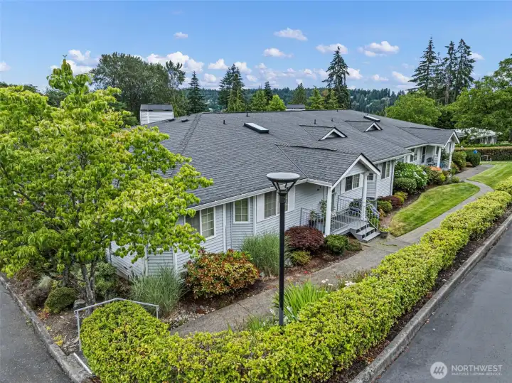 This property features convenient sidewalks that provide easy pedestrian access to the condo from either side of the building.