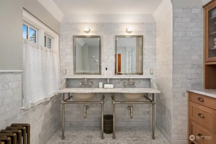 Primary ensuite with custom marble & windows to backyard Primary ensuite with custom marble & windows to backyard