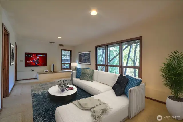 Downstairs Rec Room leading to the 2 Guest Bedrooms, Full Bathroom and Laundry Room. - Virtually Staged