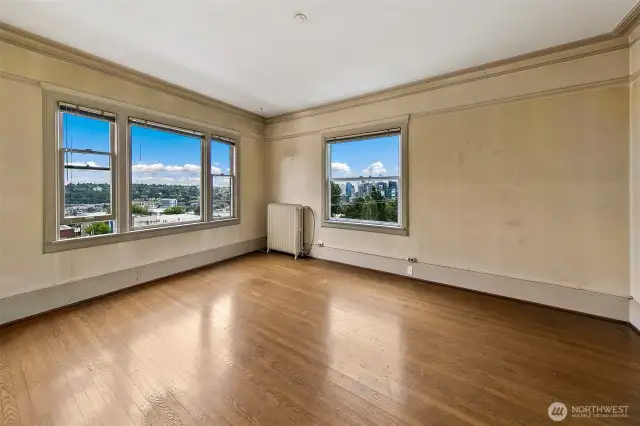 Large corner living room with views south and east.  You'll enjoy the morning sunshine and the evening lights.