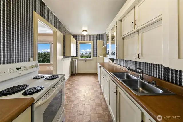Even the eat in kitchen features views.  Updated with a dishwasher.