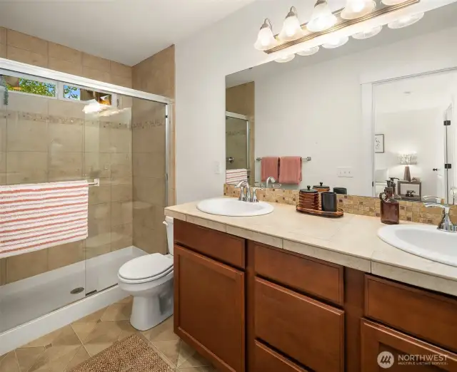 Primary en suite with walk in shower and duel sink