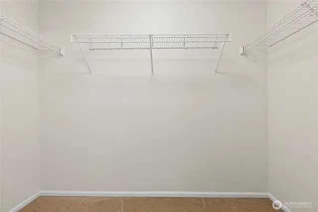 Walk in closet of primary bathroom.