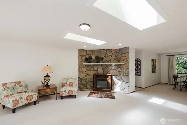 Step into the living room and you’re instantly greeted by a nostalgic nod to the past—a classic corner rock wall, straight out of the '70s, adding a unique sense of character and texture to the space.