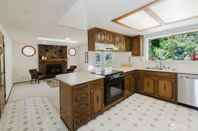 With the easy flow of the home's family room, you can join your guests at the breakfast bar, and still keep an eye on the activities in the kitchen, living area and yard.