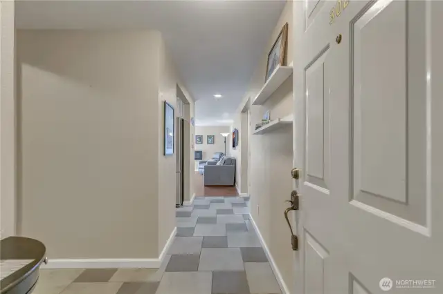 As you enter your new home, you'll be greeted by tile flooring throughout the entry, kitchen, utility room, hallway, and bathroom.