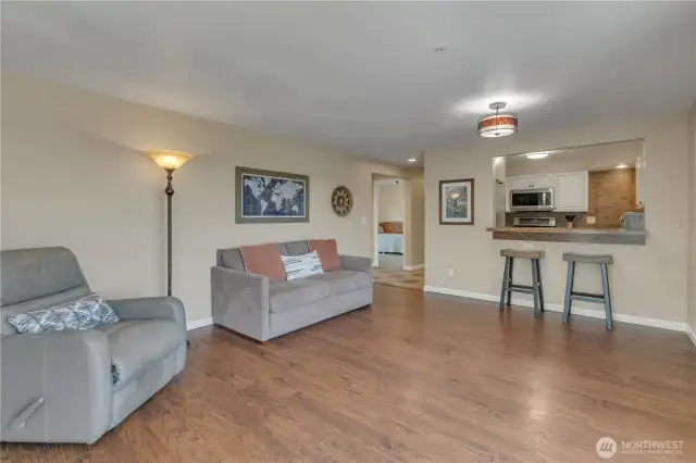 Looking from the sliding glass door, you'll see into the kitchen and the room in the foreground is one of two bedrooms.