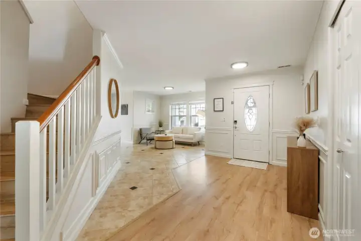 Updated floors- spacious entry w/ custom shoe cabinet