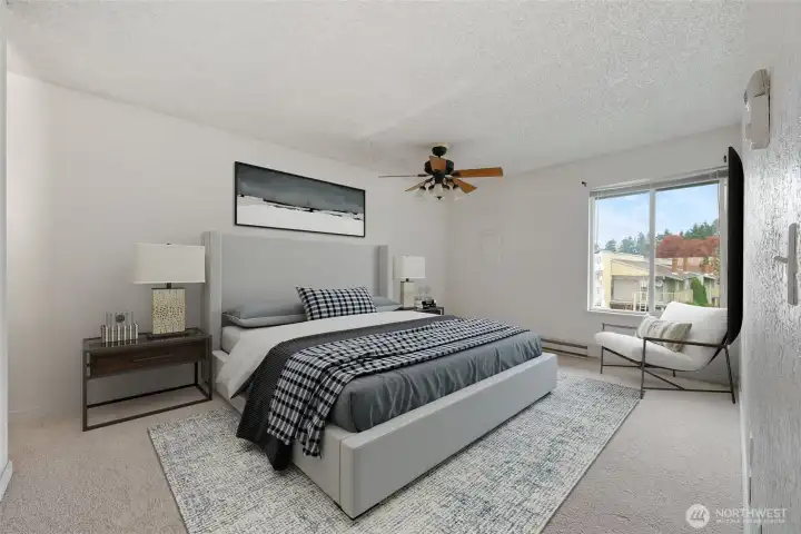 Virtually staged. Spacious primary bedroom with large window.