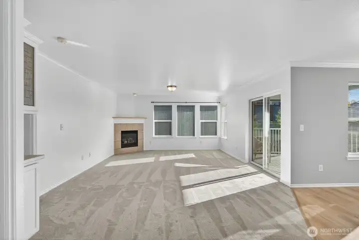 Spacious living room with cozy gas fireplace. New carpet throughout.