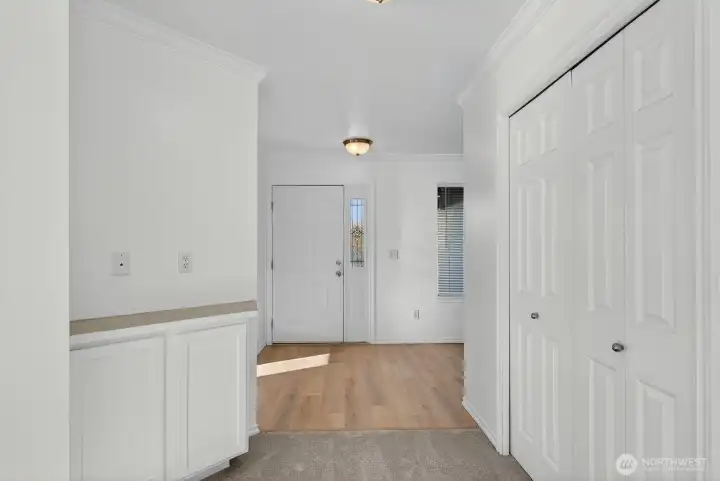 Another cabinet area and entry closet.