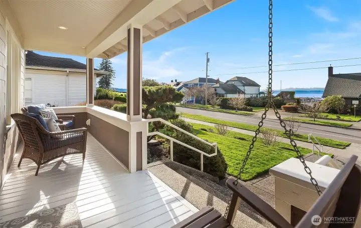 Covered front porch with swing and Sound views.