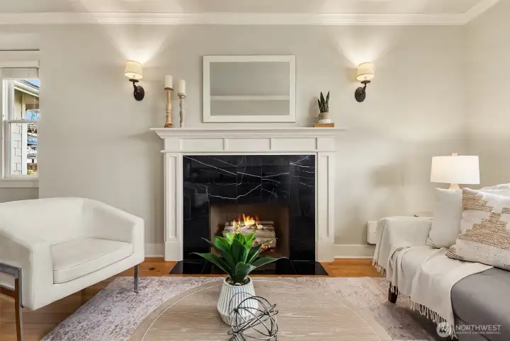 Spacious living room with fireplace. Fire added for visual (buyer to verify functionality).