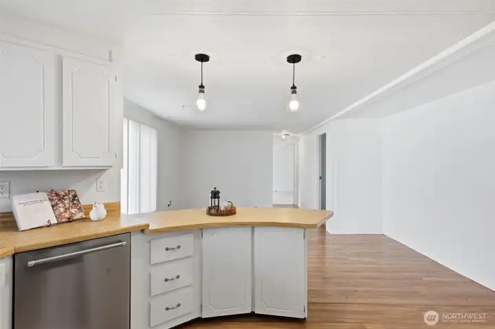 kitchen with view into the breakfast nook or extra office area