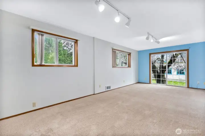 Large and bright bedroom with access to the private back yard.