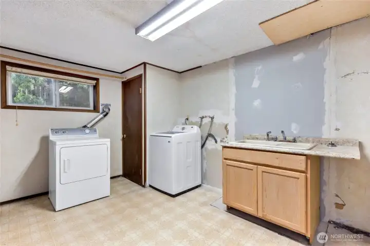 Large Laundry Space with tons of storage.