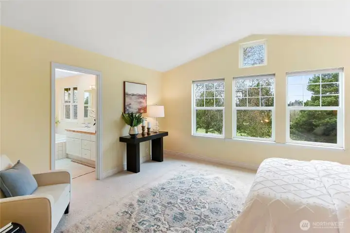 Spacious Primary Suite with views of the golf course...