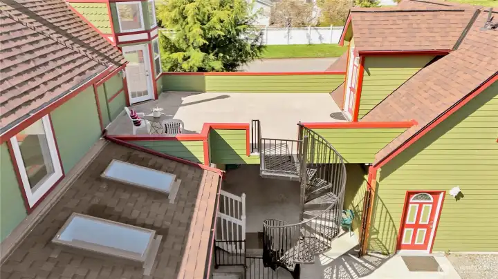 Second floor private deck, private access to guest room, spa room, and spiral staircase to court yard