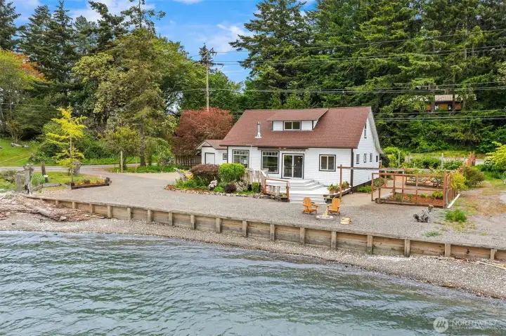Built in 1918, the home sits on 70 feet of prime inner Quartermast Harbor beach front for summer fun!