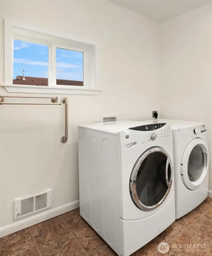 Full size washer and dryer in 3/4 bath.