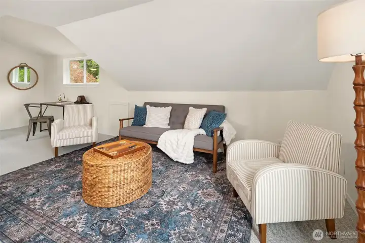At the top of the stairs this sweet get-away space greets you. Great space for reading, conversation, board games or fort-building?