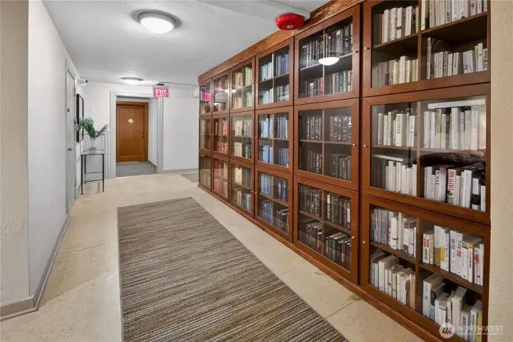 Curl up with something good. Queen's Court's beloved lending library, thoughtfully curated and organized, is one of the many community touches that make this building feel like home.