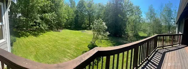 Large back yard with a green belt, perfect for entertaining large gatherings Large back yard with a green belt, perfect for entertaining large gatherings
