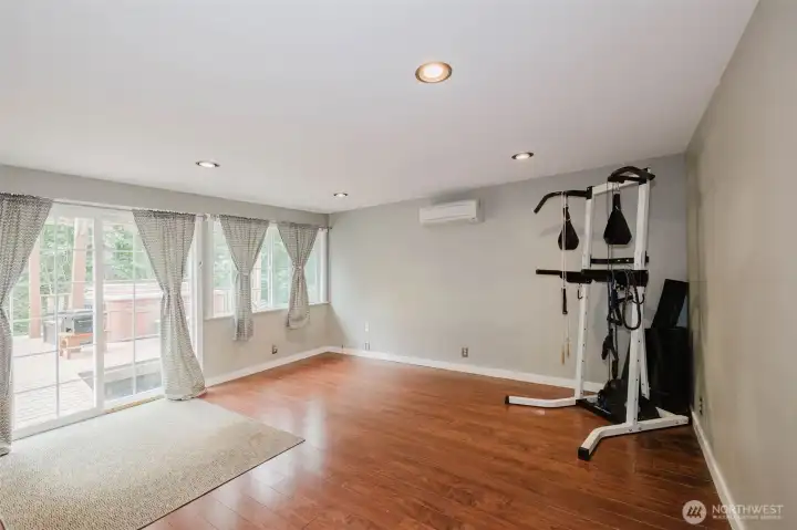 Downstairs family room with slider leading to the deck and backyard.