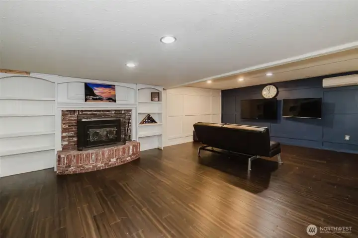Huge lower level bonus/rec room with wood insert fireplace and mini split with A/C.