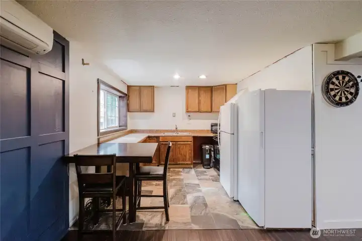 Downstairs 2nd kitchen, all appliances stay including additional freezer.