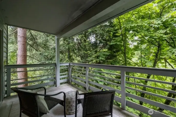 private deck with beautiful forest backdrop