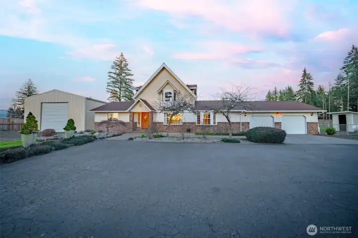 Handsome main home on a circular drive is just the start of what this property offers.