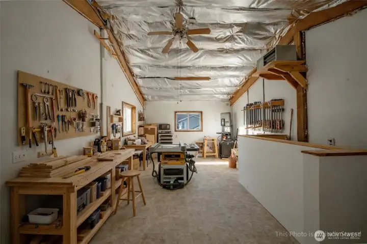 Upper floor of shop virtually staged to show how easily it can be used as a workshop