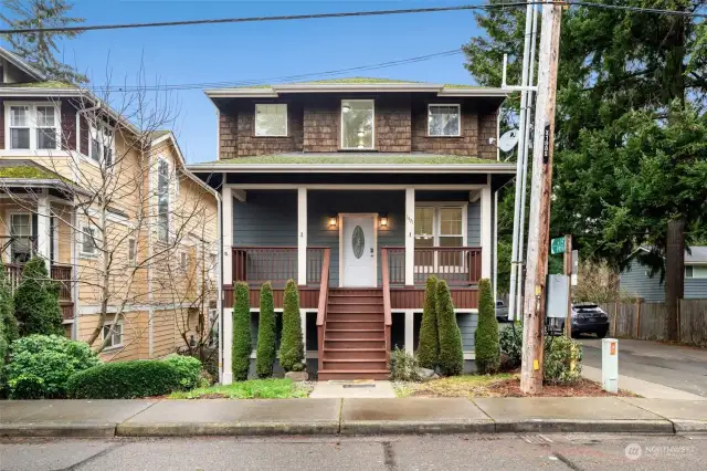 Two-story home with front porch and cedar accents.