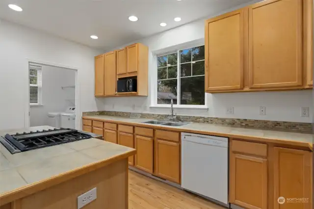 Kitchen: Spacious with wood cabinets