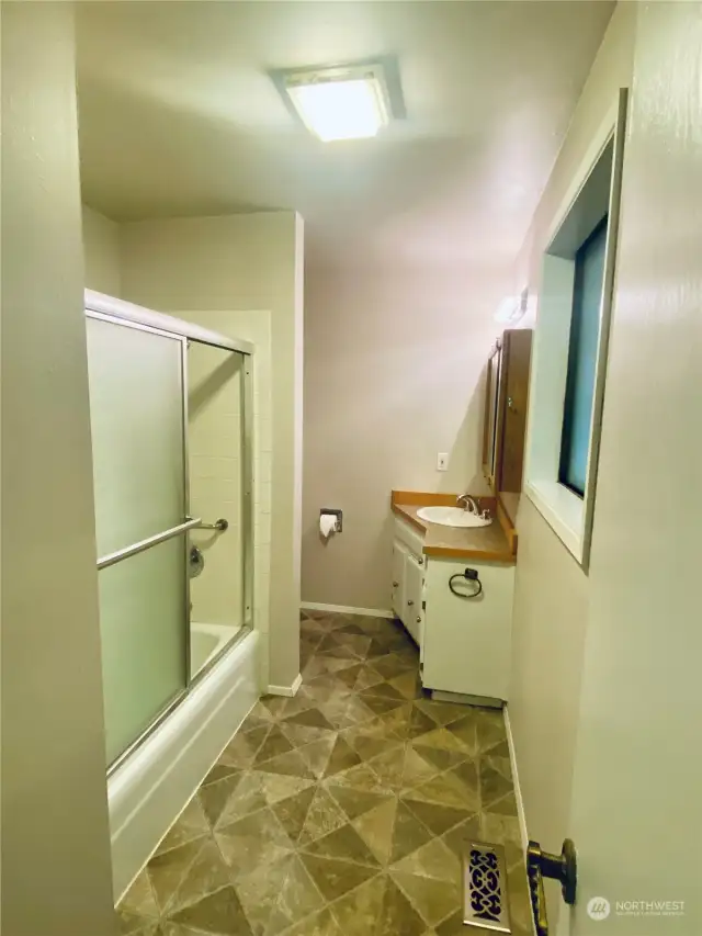 Bathroom with tub/shower combo.