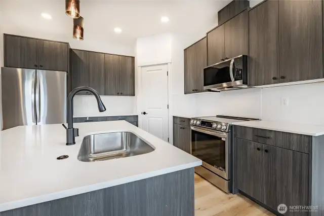 Photos shown are of a similar floor plan previously built in a different neighborhood (The Ridge in Blaine). Finishes and features may vary. Some items pictured reflect buyer-selected upgrades which are not included in the base price and may be added at an additional cost.