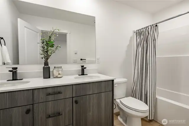 Photos shown are of a similar floor plan previously built in a different neighborhood (The Ridge in Blaine). Finishes and features may vary. Some items pictured reflect buyer-selected upgrades which are not included in the base price and may be added at an additional cost.