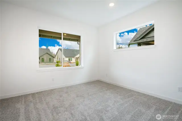 Photos shown are of a similar floor plan previously built in a different neighborhood (The Ridge in Blaine). Finishes and features may vary. Some items pictured reflect buyer-selected upgrades which are not included in the base price and may be added at an additional cost.