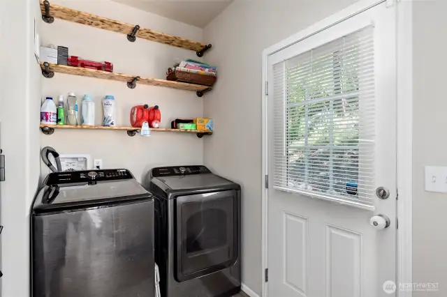 Large laundry room. With door leading to backyard.