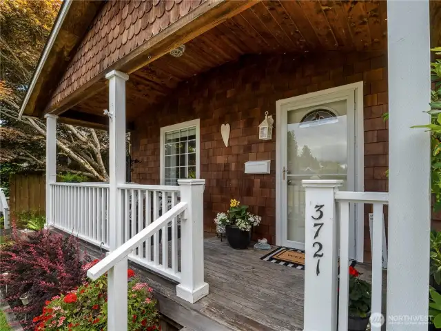 The large front porch has room for chairs and a table.