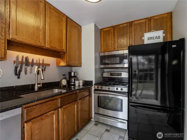 Stainless steel appliances and a large sink make cooking simple.