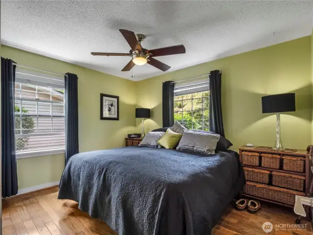 The first bedroom has 2 large windows and is towards the from of the house.