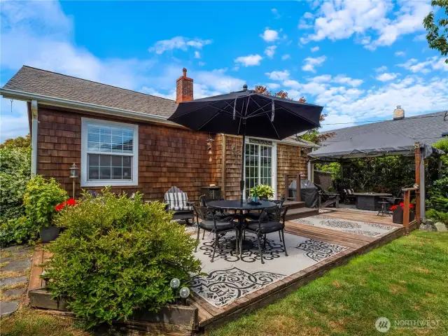 This back deck is the perfect getaway with its space for covered and uncovered seating.