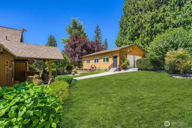 Shop includes two bay doors plus human door - adjacent to formal entry to home