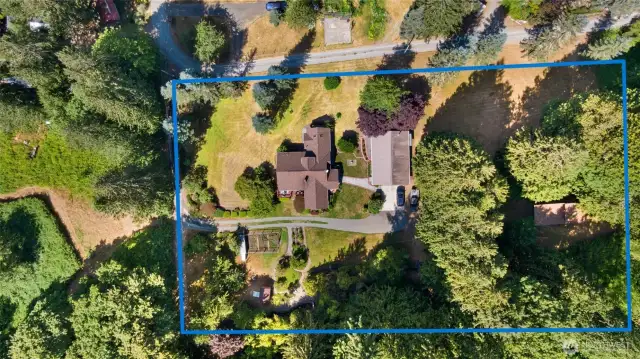 Birdseye view of lower 2.4 acreage, includes main home, shop, covered RV parking & bathhouse