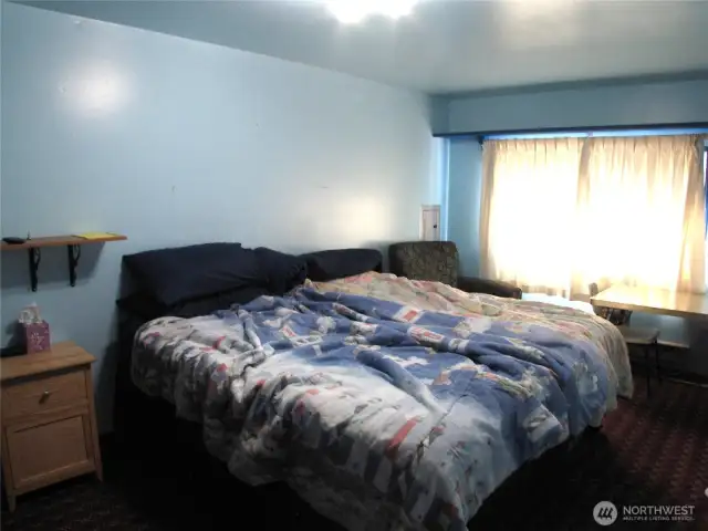 Converted shop area into extra bedroom with window and closet.