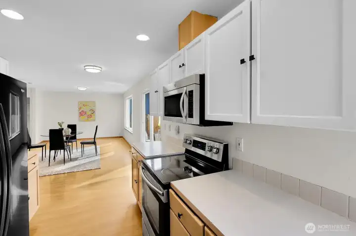 Kitchen flows nicely through eating space and family room.